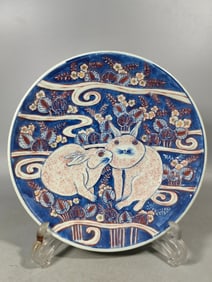 A Qing Dynasty pile carved rabbit plate