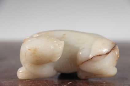 A Qing Dynasty Hetian jade auspicious beast paperweight study ornament