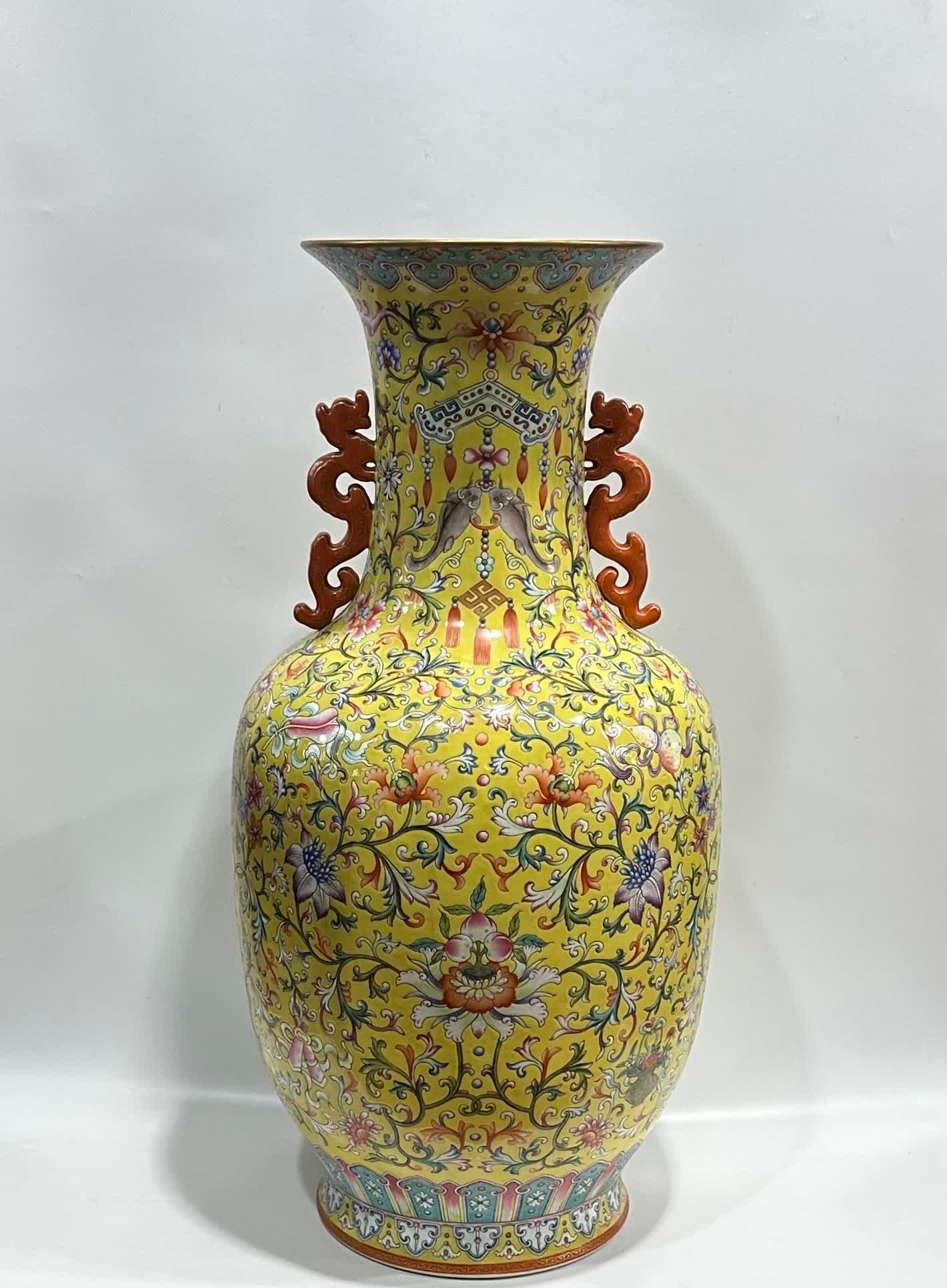 A Qianlong era yellow land eight treasure entwined pattern vase: Qianlong year of the Qing Dynasty made yellow ground eight treasure entwined pattern vase SIZE: Height 78cm Diameter 26cm Belly diameter 41cm (The Dimensions Of All Batches Are Manually Measured.If Yo