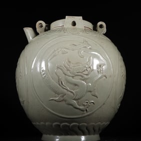 A Tang Dynasty Yue kiln secret color celadon high-relief dragon pattern lock jar