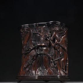 A Qing Dynasty agarwood flower and bird pattern pen holder