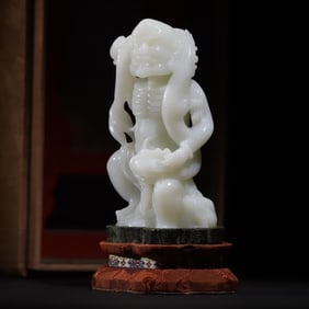 A statue of a dragon descending Arhat in the Qing Dynasty mutton fat white jade