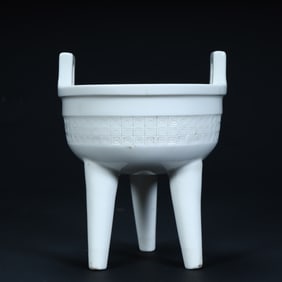 A Qing Dehua white porcelain imitation Xuande tripod furnace