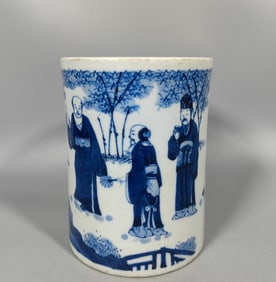 A Qing Dynasty blue and white figure pen holder leaf model