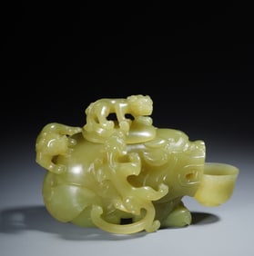 A piece of Hetian topaz and a strange beast holding a cup dragon pattern inkstone