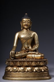 A seated statue of Shakyamuni Buddha in copper gilt in the Qing Dynasty