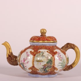 A Qing Qianlong enamel carved alum red gilded window coral red flower teapot