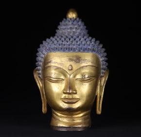 A piece of Qing Dynasty copper gilt Shakyamuni Buddha's head