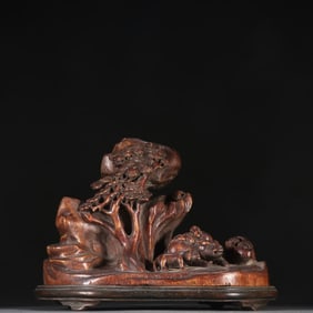 An agarwood character story mountain ornament