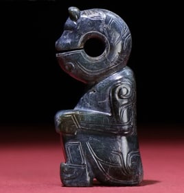 A Han Dynasty jasper dragon head human body round carved handle