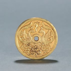 A copper gilt double phoenix pattern flower money