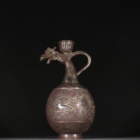 A Qing Dynasty silver phoenix pattern pot