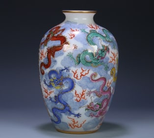 A Qing Dynasty enamel "Five Hundred Arhats" dragon pattern bottle