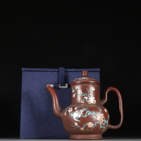 A Qing Dynasty purple sand colorful flower and bird pattern teapot