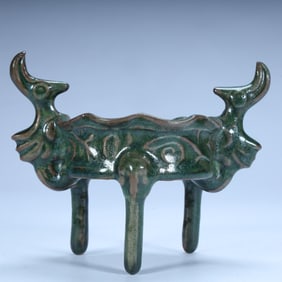 Qing Dynasty antique copper glazed phoenix head three-legged furnace