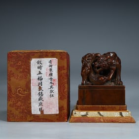 A Qing Dynasty sandalwood three lion button square seal