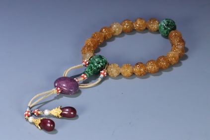 A piece of Qing Dynasty jade yellow tourmaline group longevity pattern eighteen sons held