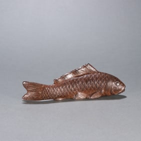A copper fish ornament