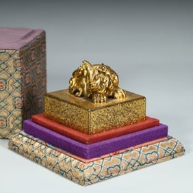 A Qing Dynasty copper gilt beast button seal