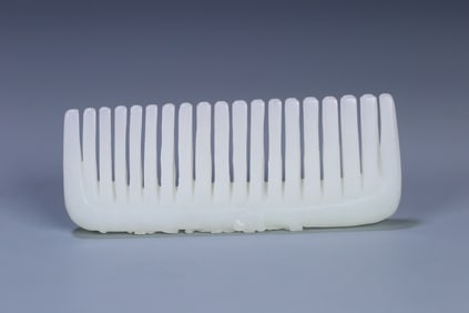 A Qing Dynasty Hetian jade plum blossom comb
