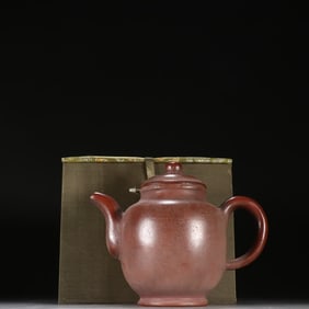 A purple sand teapot