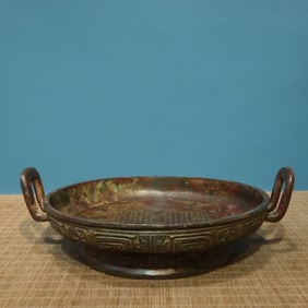 A piece of bronze-wall plate