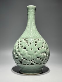 A Qing Qianlong bean celadon glaze hollow entwined lotus gall bottle