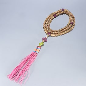 A Qing Dynasty silver-gilt tourmaline 108 Buddha beads