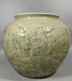 A piece of azure glaze carved double dragon bead jar washing