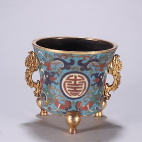 A Qing Dynasty copper-gilt cloisonné three-legged incense burner