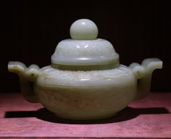 A Qing Dynasty amphora beast face pattern green jade furnace