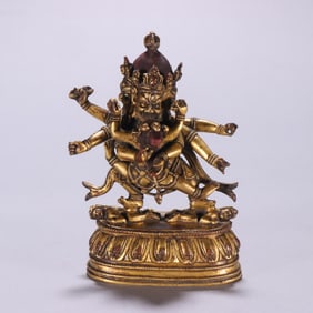 A Qing Dynasty bronze gilt six-armed protector Vajra statue