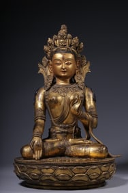 A seated statue of Tara in copper gilt in the Qing Dynasty
