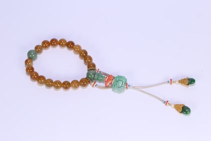 A piece of Qing palace yellow tourmaline eighteen seeds held