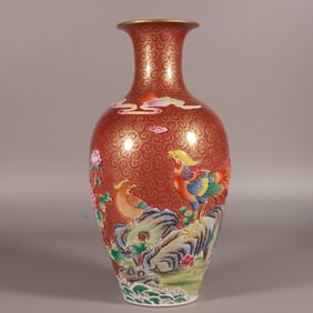 A Qing Qianlong enamel color carved phoenix tail grass brocade chicken appreciation bottle