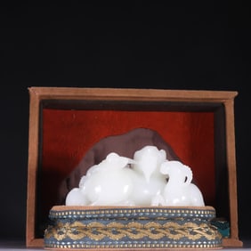 A Qing Dynasty Hetian jade three sheep Kaitai ornament