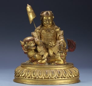 A seated statue of the King of Heavenly King in copper gilt in the Qing Dynasty