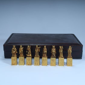 Qing Dynasty copper gilt Eight Immortals seal, with mahogany box.