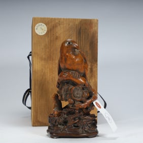 A Qing Dynasty boxwood) "happy eyebrow" wood carving ornament