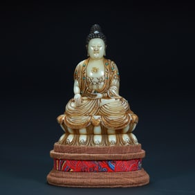 A seated statue of Amitabha Buddha painted in gold with Shoushan stone in the Qing Dynasty