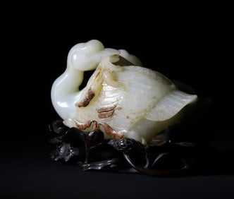 A Qing Dynasty lotus pond mother goose holding a wheat ear ornament