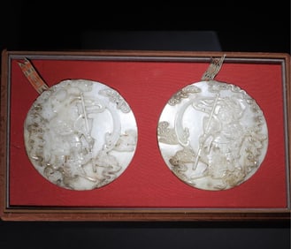 A pair of Qing Dynasty white jade firewheel generals
