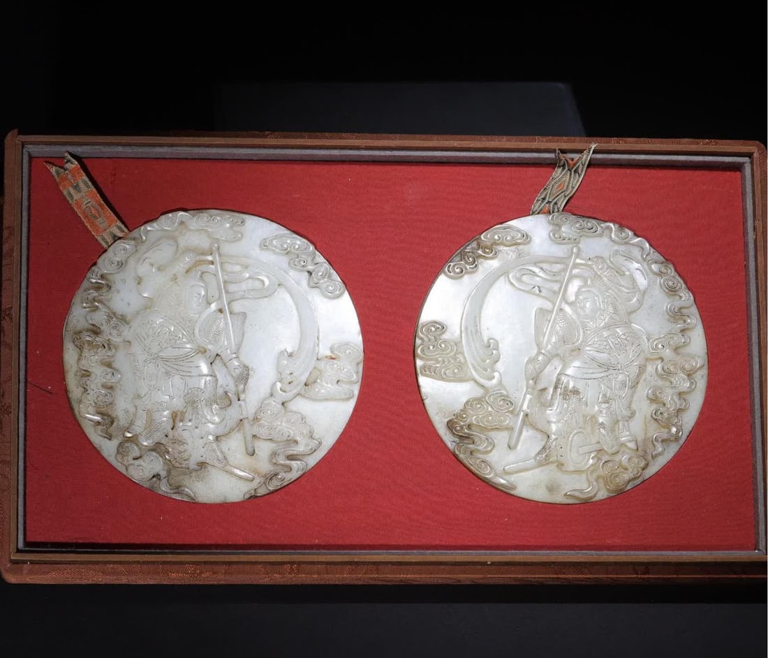 A pair of Qing Dynasty white jade firewheel generals (1 of 10)