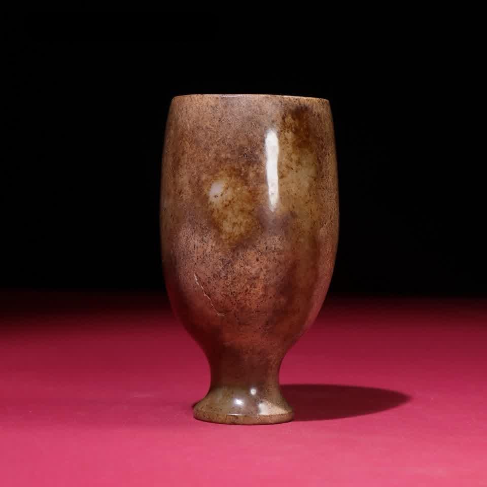 A Han Dynasty jade cup: Han Dynasty jade cup SIZE: 106x60x5mm W:255g (The Dimensions Of All Batches Are Manually Measured.If You Need More Detailed Information, Please Contact Our Customer Service Before Bidding.)