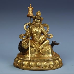 A seated statue of the King of Heavenly King in copper gilt in the Qing Dynasty