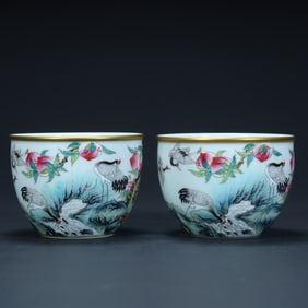 A pair of Qing Dynasty pastel "crane peach birthday" pattern cups