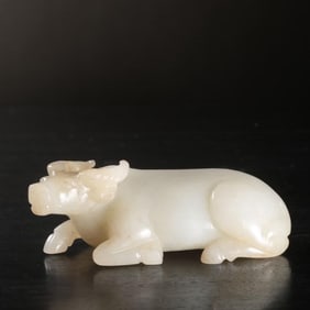 A piece of Qing Hetian white jade cow paper weight
