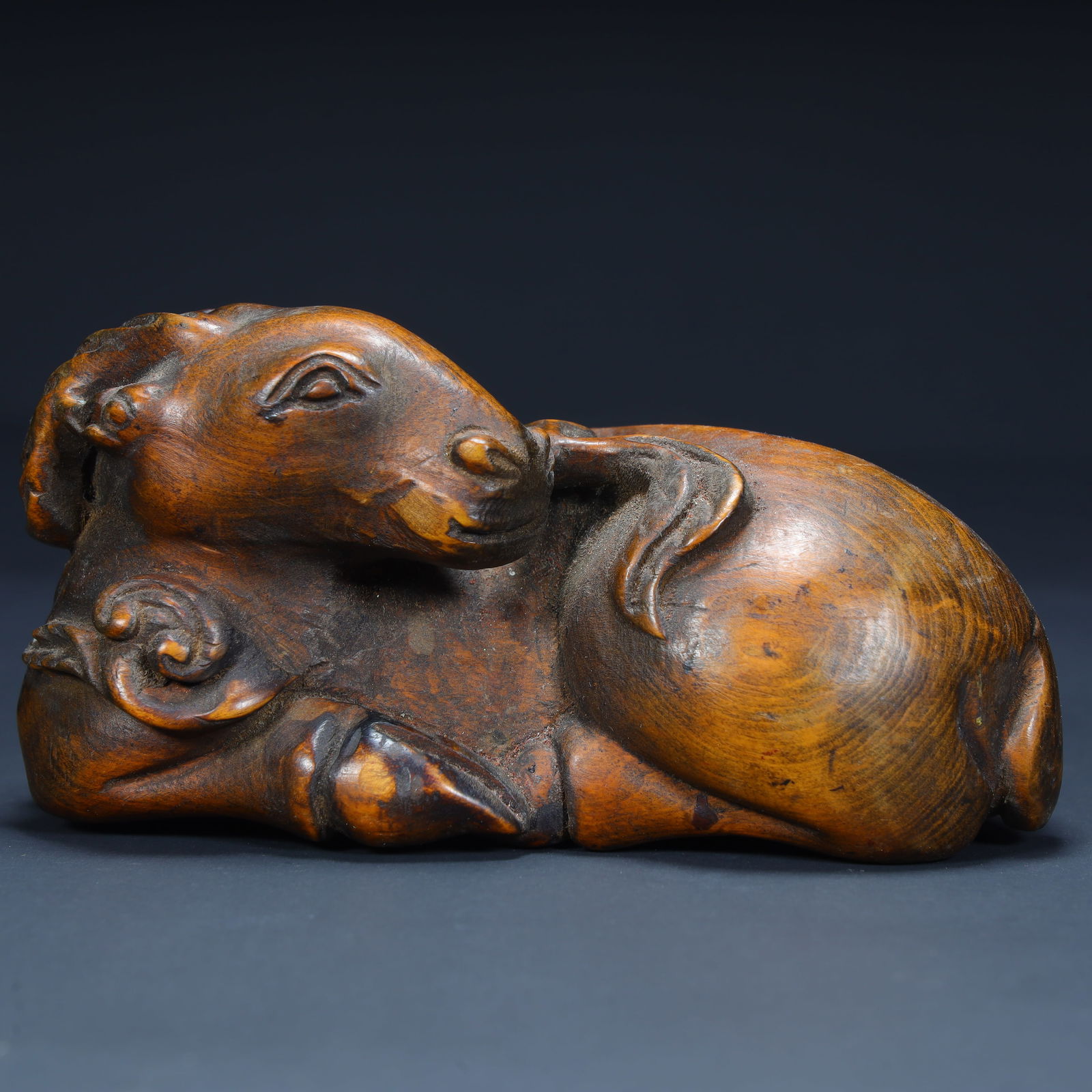 A Qing Dynasty boxwood carved lying sheep paperweight (1 of 10)
