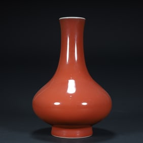 A Qing Qianlong official kiln Ji red glazed water chestnut bottle