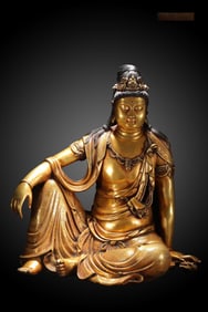 A seated statue of Guanyin in the Ming Dynasty with a fine cast copper tire gilded